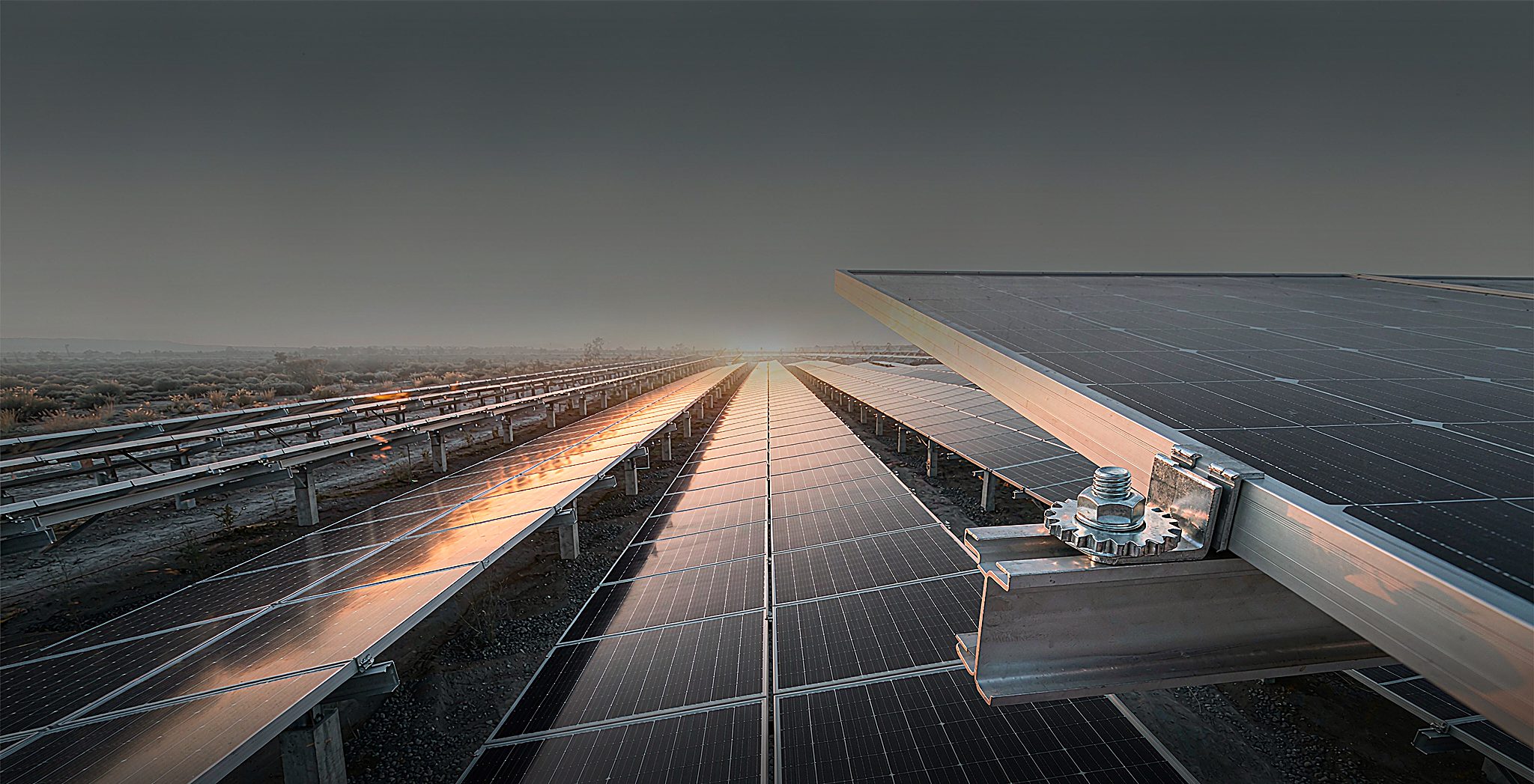 Stainless mounting hardware on a solar rail at a PV plant